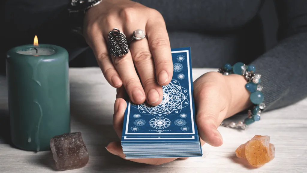 A mystical table with an intricate spread of oracle cards, illuminated by soft, warm lighting. The cards are arranged in a symmetrical pattern, radiating outward from the center, their vibrant illustrations casting a serene, contemplative atmosphere. In the background, a velvety, muted backdrop complements the scene, creating a sense of depth and focus on the cards. The overall composition conveys a feeling of deep insight, guidance, and a connection to the divine. The image captures the essence of "Deepening Your Oracle Card Practice" within the context of "Discover the Power of Oracle Card Reading for Guidance and Insight." Deepening Your Oracle Card Reading Practice