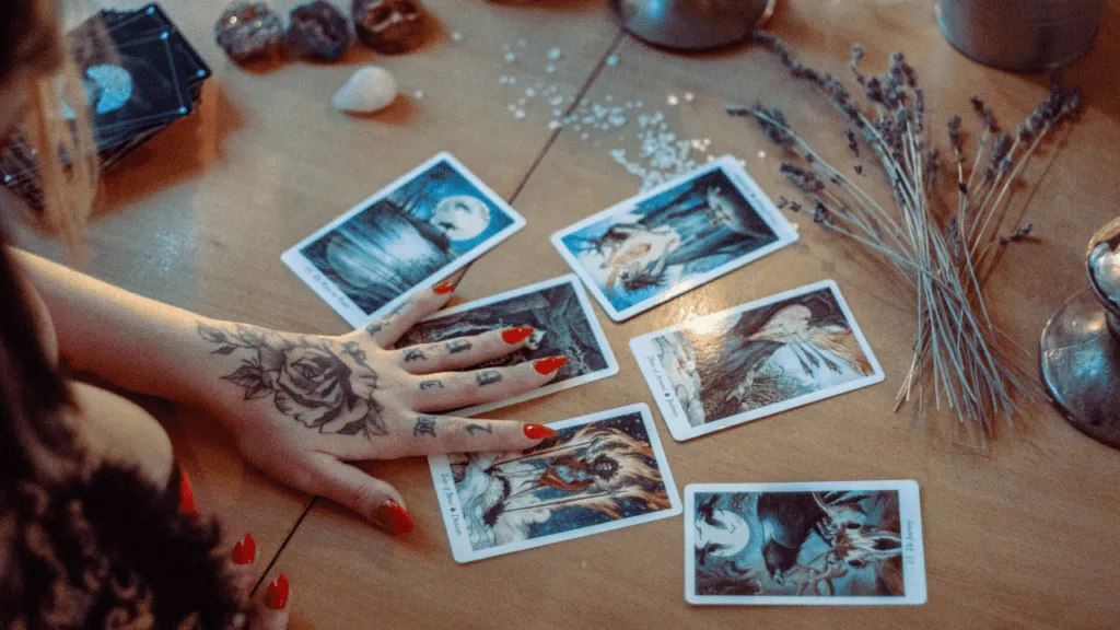 A serene, softly lit table top displays an elegant Oracle card spread, inviting contemplation and inner guidance. In the foreground, a deck of beautifully illustrated cards is fanned out, each revealing its arcane symbols and imagery. Surrounding the cards, a scattering of natural elements like quartz crystals, feathers, and dried flowers lend an air of mysticism. The middle ground features a wooden surface with a subtle, weathered texture, providing a grounded, earthy backdrop. Overhead, warm, diffused lighting casts a gentle glow, creating a sense of tranquility and introspection. The overall mood is one of quiet wisdom, intuitive insight, and a reverence for the unseen forces that guide our path. Step-by-Step Oracle Card Reading