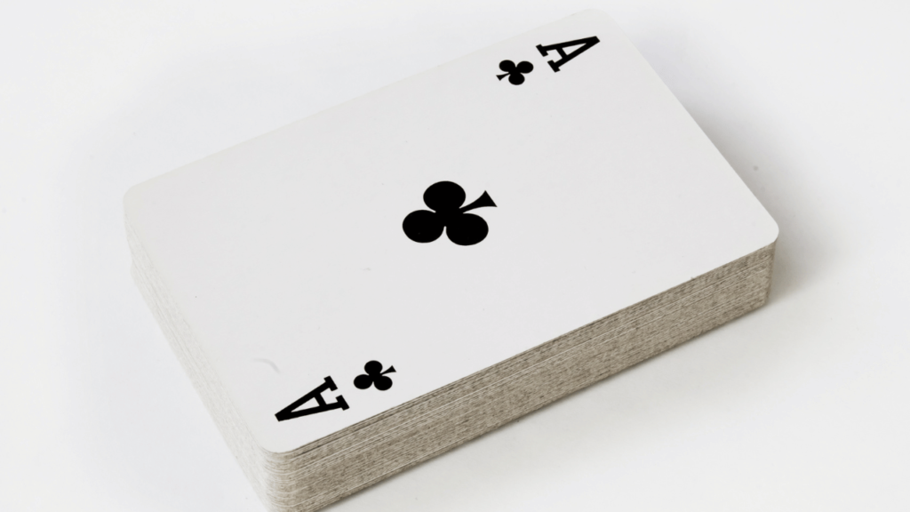 A vibrant collection of antique playing cards, their intricate designs and symbolic motifs laid out against a richly textured parchment background. In the foreground, the face cards - the kings, queens, and jacks - stand out with their regal poses and elegant costumes, conveying a sense of history and the hidden language of these iconic gaming pieces. Soft, warm lighting illuminates the cards, casting subtle shadows and highlighting the nuanced details of the artwork. The overall composition evokes a sense of mystery and the timeless allure of these timeless symbols of chance, strategy, and human storytelling. The Hidden Language of Face Cards